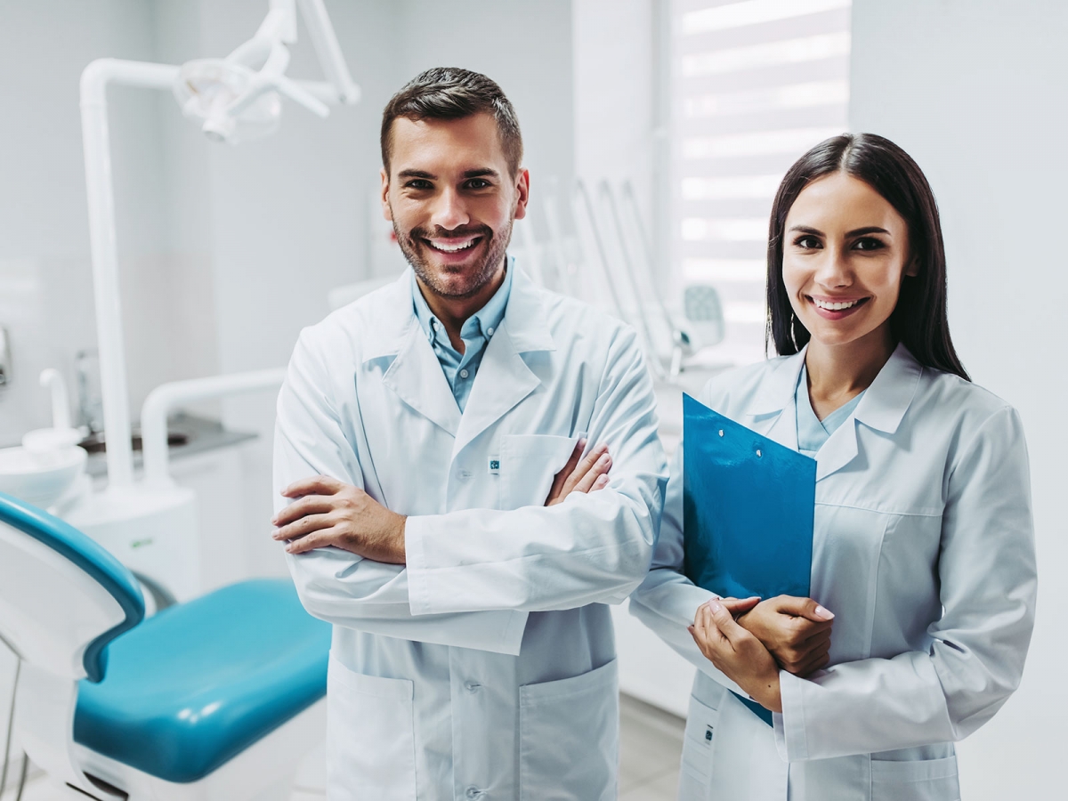 portrait of two smiling doctors